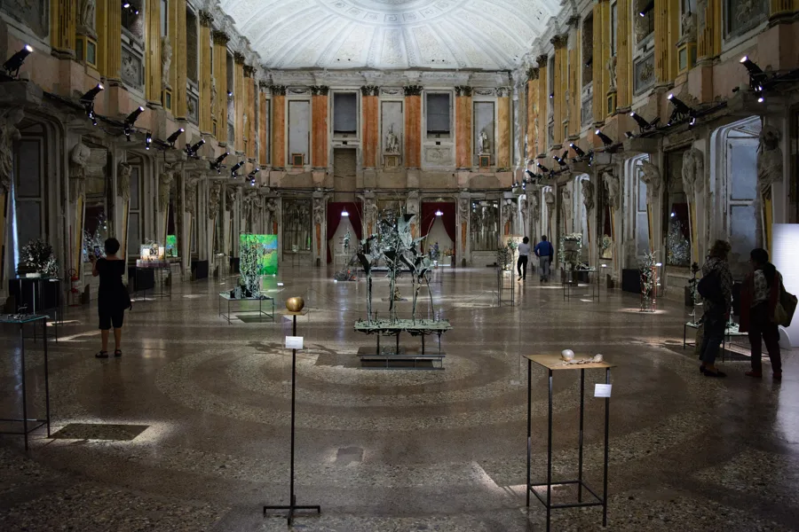 The Sala delle Cariatidi in the Palazzo Reale, Milan, kept with the marks of its wartime damage. Architectural reference, not a project of the House.