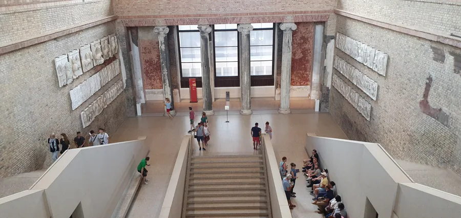 The grand staircase hall of the Neues Museum, Berlin, restored by David Chipperfield. Architectural reference, not a project of the House.